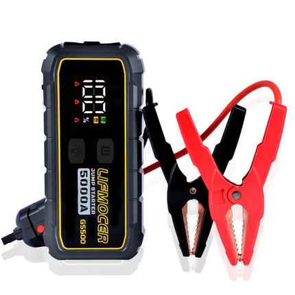 Jump starter with digital display and red and black clamps on a white background